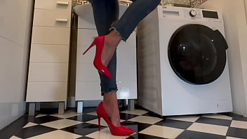 Wetting extremely jeans and red classic high heels and play with pee
