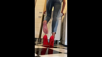 Wetting extremely jeans and red classic high heels and play with pee
