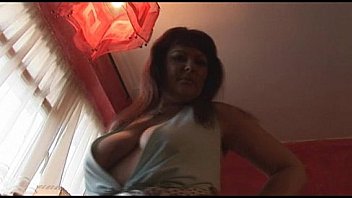 Busty mature brunette babe strips and spreads