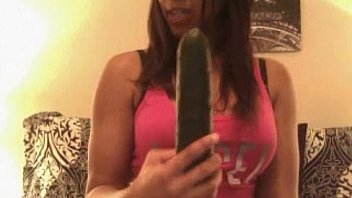 Teen enjoying a big cucumber more at