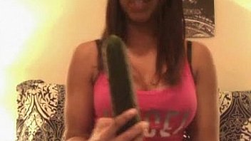Teen enjoying a big cucumber more at