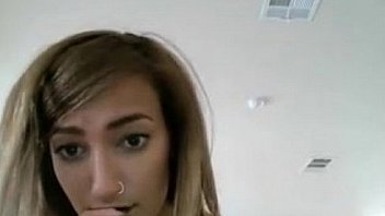 Brownhaired girl curled up on chair bating