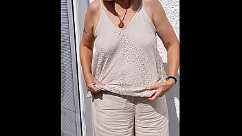 Flopping her tits out outdoors