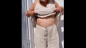 Flopping her tits out outdoors