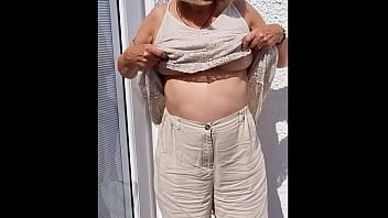 Flopping her tits out outdoors