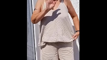 Flopping her tits out outdoors