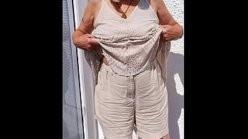 Flopping her tits out outdoors