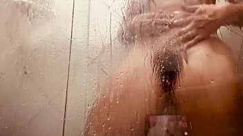 Milf filming herself washing her hairy pussy in the bathroom