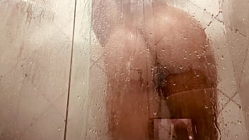 Milf filming herself washing her hairy pussy in the bathroom