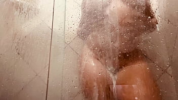 Milf filming herself washing her hairy pussy in the bathroom