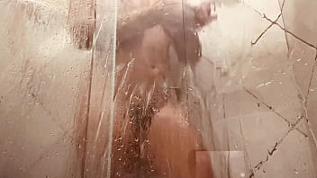 Milf filming herself washing her hairy pussy in the bathroom