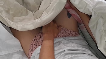 Our risky masturbation under the blanket next to my stepmother