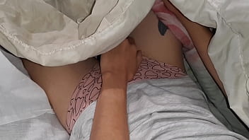 Our risky masturbation under the blanket next to my stepmother