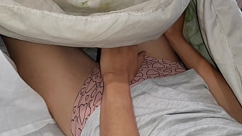 Our risky masturbation under the blanket next to my stepmother
