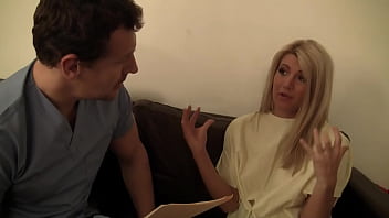 Blonde gives blowjob through glory hole