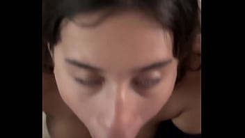 Horny brunette sucking dick backstage