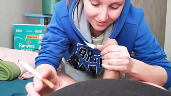 Brunette in hoodie sucking cock