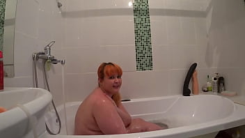A bbw redhead takes a bath with rubber cocks gorgeous juicy buttocks doggy style