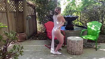 Sunny lane rides her favorite glass dildo outdoors by a fountain