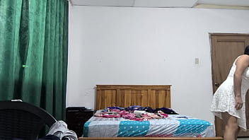 The busty executive chooses a white dress and then starts making sensual movements showing her beautiful vagina