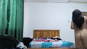 The busty executive chooses a white dress and then starts making sensual movements showing her beautiful vagina