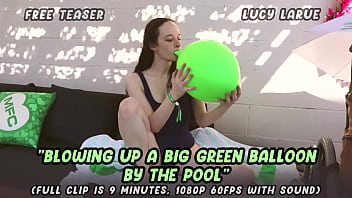 Blowing Up A Big Green Balloon By The Pool thumbnail