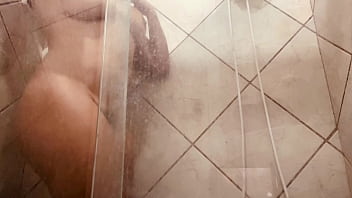 Girl being filmed while taking a shower showing off her hairy pussy