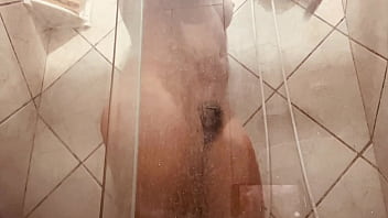 Girl being filmed while taking a shower showing off her hairy pussy