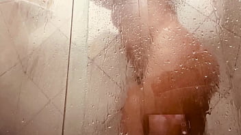 Girl being filmed while taking a shower showing off her hairy pussy