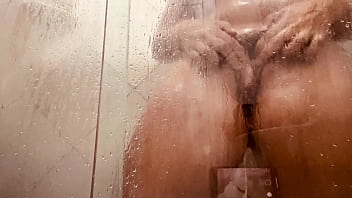 Girl being filmed while taking a shower showing off her hairy pussy