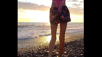 Sunset girl at the sea beach
