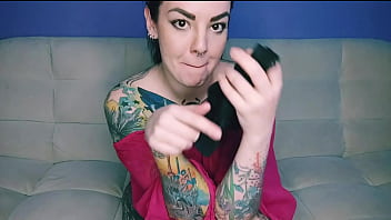 Tattooed hottie with a big ass takes her panties in her mouth and slaps her fucking ass