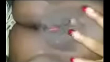 Dark skinned ebony playing with that kitty cat