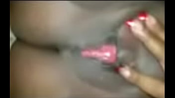 Dark skinned ebony playing with that kitty cat