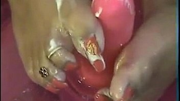 Close up foot job with a pink dildo