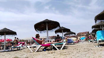 Brunette with huge tits on the beach part 1