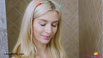 Chic blonde in style enjoys a sensual bath