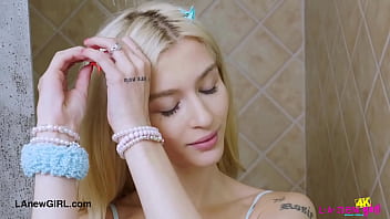 Chic blonde in style enjoys a sensual bath