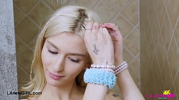 Chic blonde in style enjoys a sensual bath