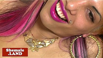 Pinkhair tgirl tugging cock on bed