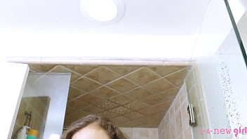 Sophisticated brunette beauty enjoys a sensual bath