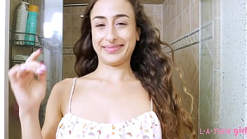 Sophisticated brunette beauty enjoys a sensual bath