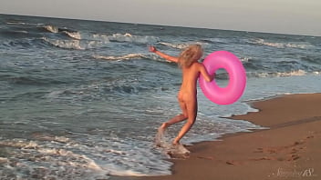 Girl agnes walks around the beach full nude with an audience