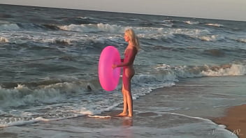 Girl agnes walks around the beach full nude with an audience