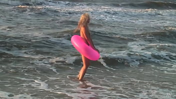 Girl agnes walks around the beach full nude with an audience