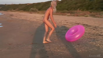 Girl agnes walks around the beach full nude with an audience