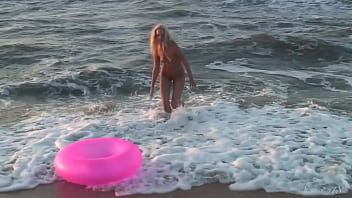 Girl agnes walks around the beach full nude with an audience