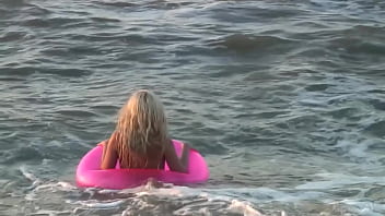 Girl agnes walks around the beach full nude with an audience