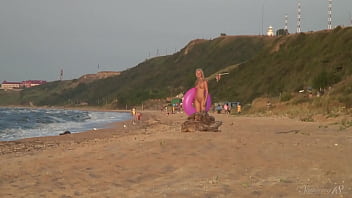Girl agnes walks around the beach full nude with an audience