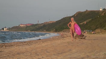 Girl agnes walks around the beach full nude with an audience